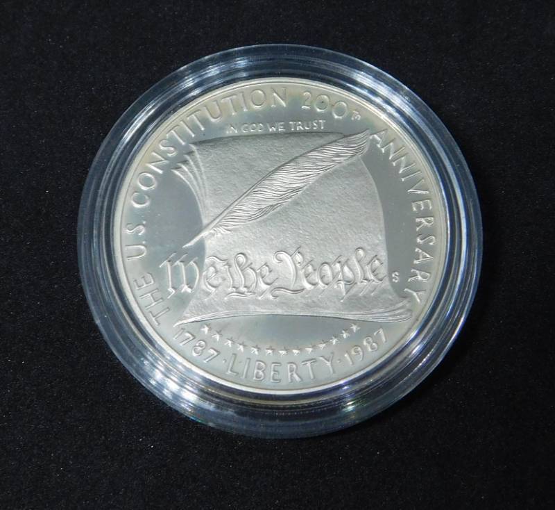 lot 31 image: 1987 S WE THE PEOPLE Mint State Commemorative Silver Dollar In Coin Capsule
