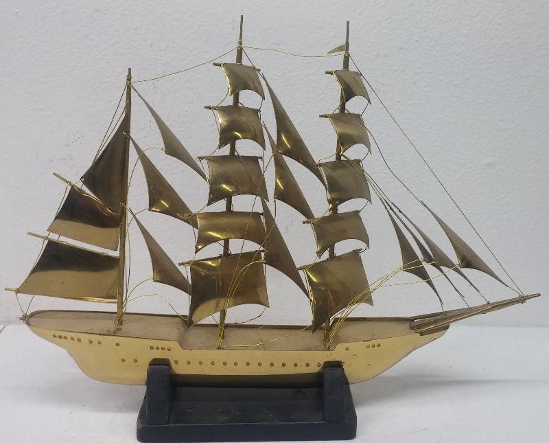 lot 73 image: Yellow Metal Sail Boat Model