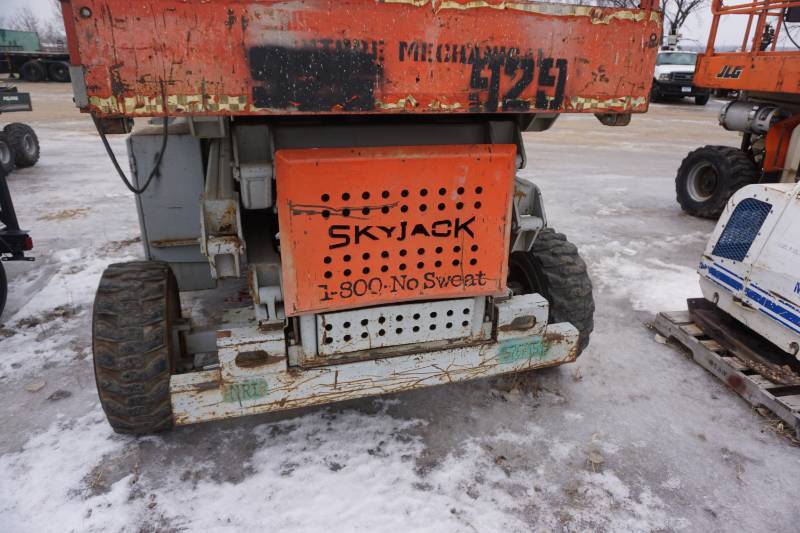lot 11 image: Sky Jack Model SJ8831 4 x 4 Rough Terrain Scissors Lift