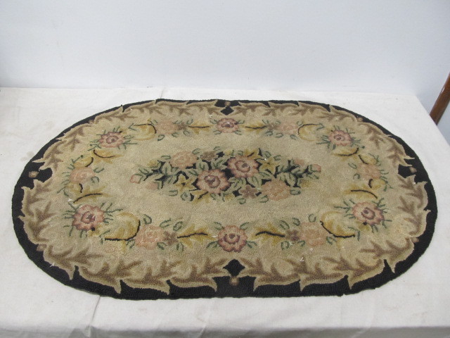 lot 65 image: Vintage Hand Made Oval Wool Rug