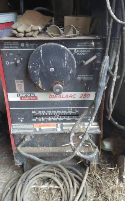lot 41 image: Lincoln Electric Ideal Arc Welder 220Volt With Lot Of Assorted Welding Rod, Extension Cord & Helmet