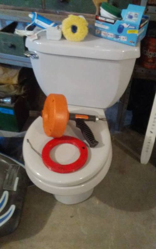 lot 122 image: American Standard Grey Toilet (Replaced For Handi-Cap Needs), Ridgid Snake, Other Drain Snake, Black & Decker Scrubber