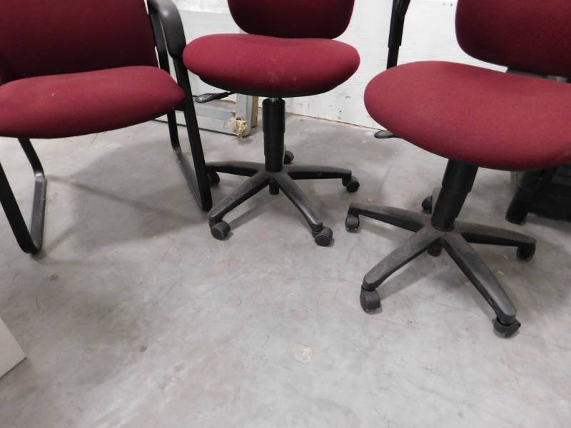 Three Maroon Office Chairs