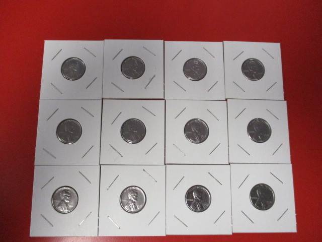 lot 12 image: One Dozen (12) Denver Mint 1943 Emergency Issue Steel Lincoln Wheatback Pennies. Looks to be in incredible condition and carded for protection.