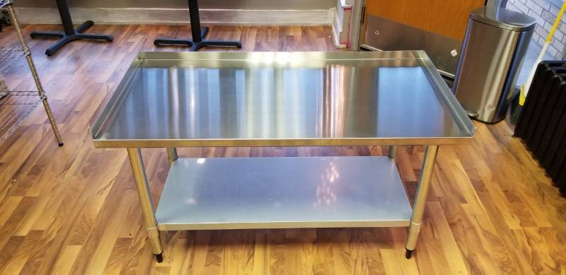 lot 26 image: Sportsman Series Upturned Edge Stainless Steel Work Table 24 x 48 Inches.