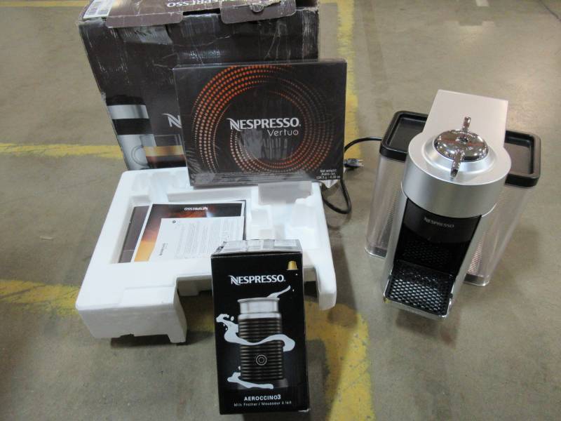 lot 72 image: Nespresso DeLonghi Vertuo Silver Single Serve Coffee and Espresso Machine with Aeroccino, ENV135SAE - NEW in BOX.