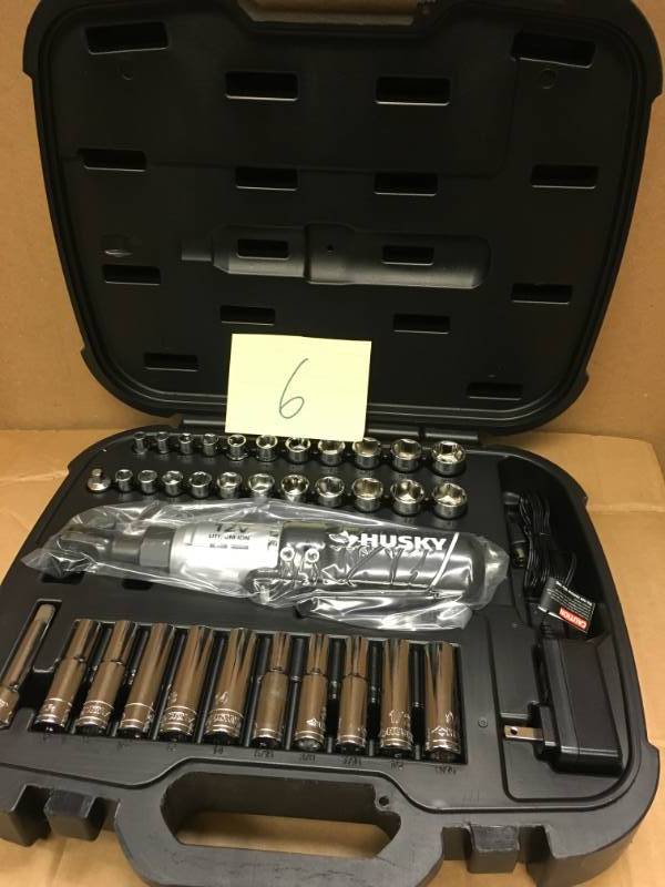 lot 6 image: Husky 12-Volt Lithium-Ion 38 in. Drive Cordless Ratchet W 34 Piece Socket Set, Battery, Charger, and Carrying Case not used