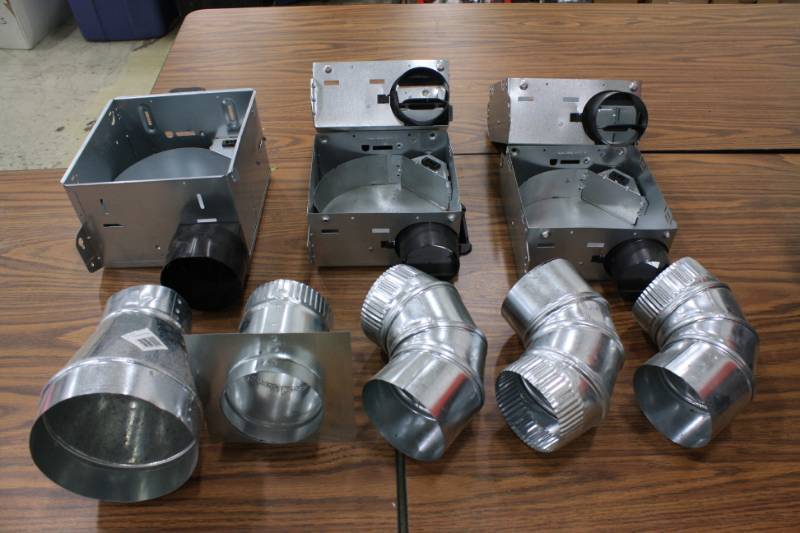 lot 33 image: Exhaust Fan Housing 5 Qty & Duct Work Accessories