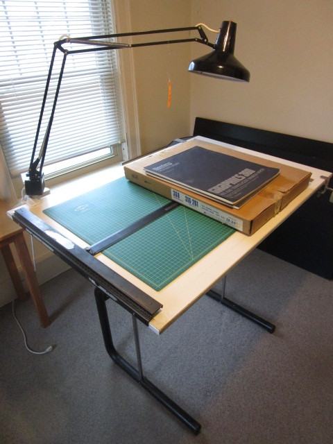 lot 136 image: DRAFTING TABLE WITH LIGHT AND SUPPLIES