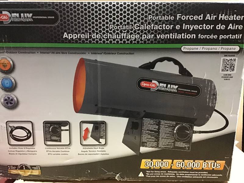 lot 8 image: Dyna-Glo Delux 30K-60K BTU LP Forced Air Propane Portable Heater  open box in like new condition
