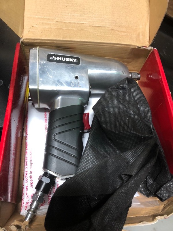 Husky  12 in. 300 ft. lbs. Impact Wrench in working conditions