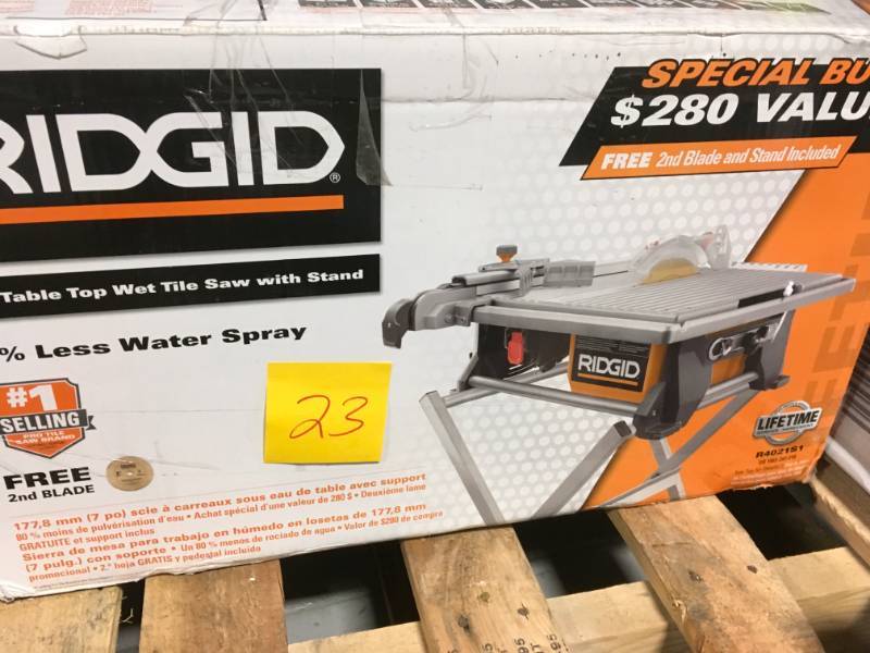 lot 23 image: RIDGID 120-Volt 7 in. Table Top Wet Tile Saw with Free Stand and Bonus Blade MISSING ONE FOOT PAD ON STAND in like new condition