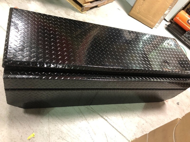 lot 102 image: Lund  60 in. Flush Mount Truck Tool Box not used whit small dent on the top