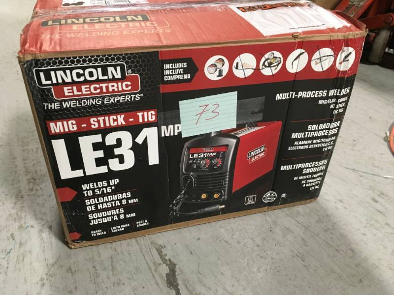 lot 73 image: Lincoln Electric 140 Amp LE31MP Multi-Process StickMIGTIG Welder with Magnum Pro 100L Gun, MIG and Flux-Cored Wire, Single Phase, 120V MISSING 3 PCS in like new condition
