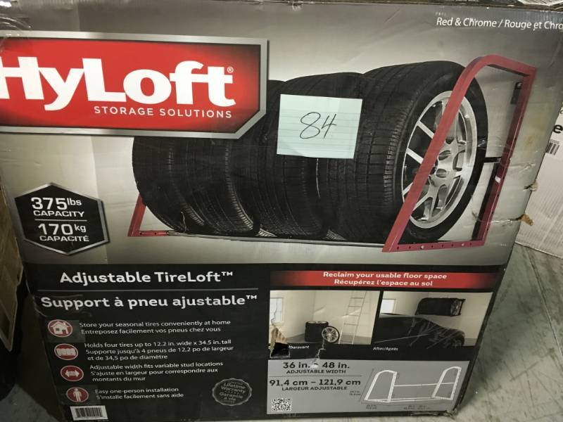 lot 84 image: HyLoft 48 in. W Adjustable Garage Wall Tire Rack in Red in like new condition