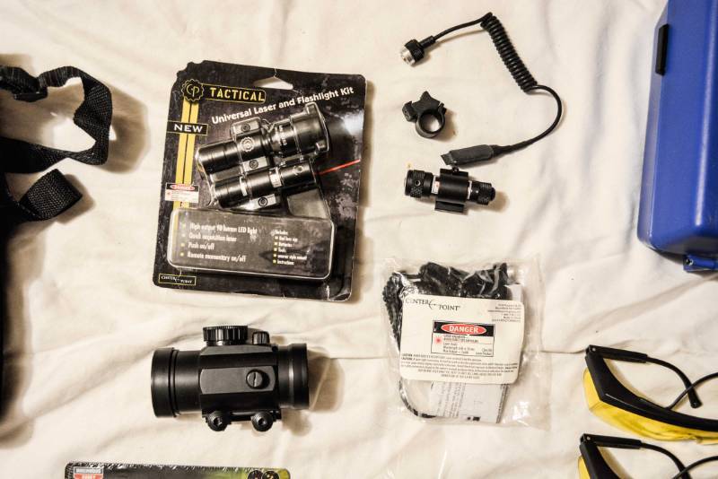 lot 14 image: Laser Sights, Knives, Shooting Targets, Spotting scope, Safety Glasses, Hand gun case LOT