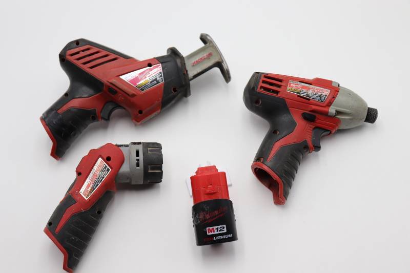 lot 3 image: Milwaukee 12V Impact DriverSawzallFlashlightBattery