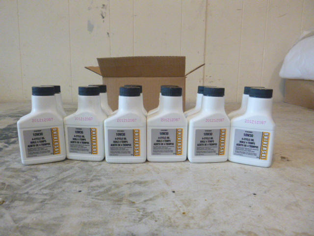 12 bottles of Universal 10W30 4-Cycle Oil