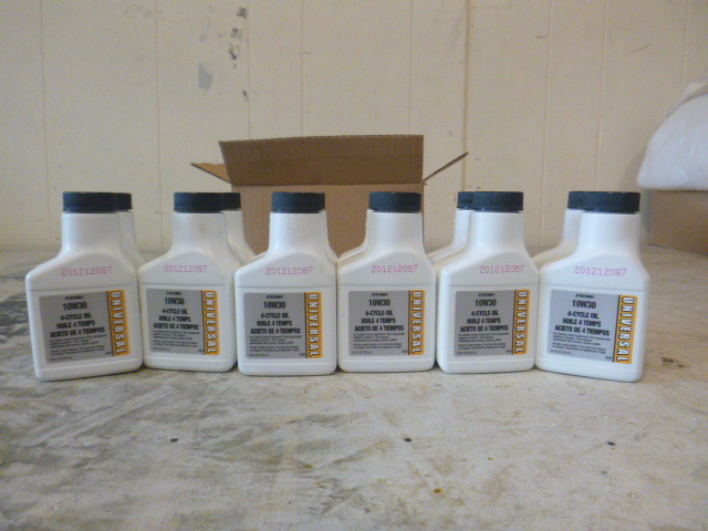 12 bottles of Universal 10W30 4-Cycle Oil