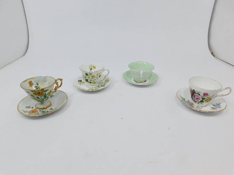 lot 73 image: Four Bone China Collectors Cup & Saucer Sets