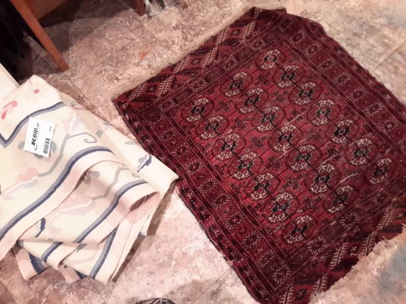 lot 560 image: 1 Very Large Area Rug 1 Smaller Darker Rug