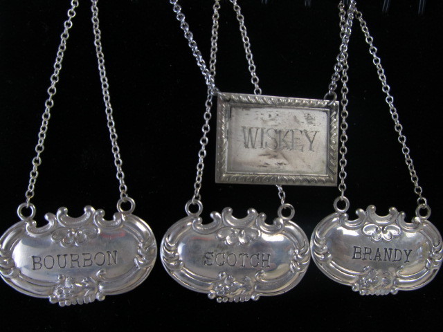 lot 93 image: 4 Vintage Signed WALLACE & S. Kirk & Sons Sterling Silver Liquor Bottle Decanter Tags