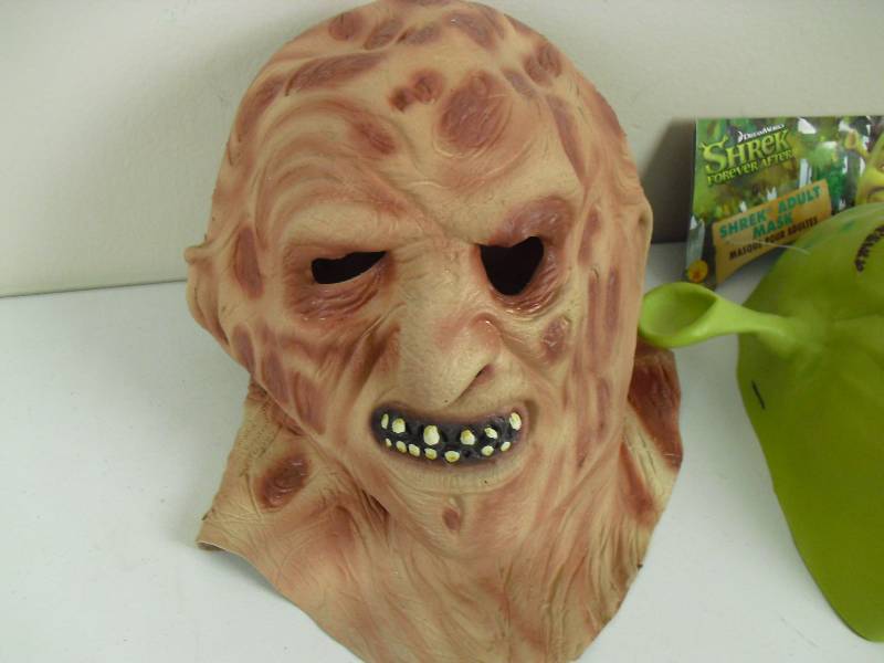 lot 88 image: Pair Of Rubber Masks Freddy Krueger Shrek