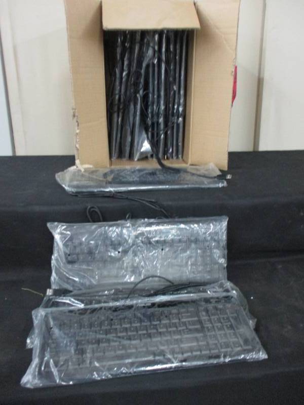 14 unopened, unused keyboards in plastic still