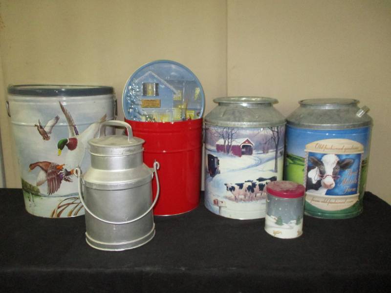 Cream can and tins with cows on them