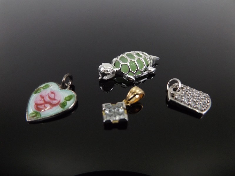 4 Marked .925 Sterling Silver CharmsPendants