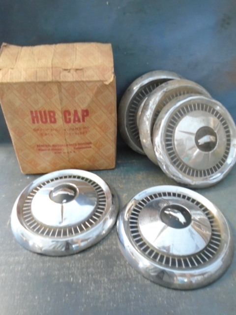 lot 55 image: Vintage GM Hubcaps