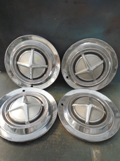 lot 57 image: Vintage 60s Chrysler Hubcaps