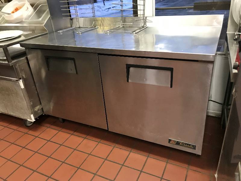 lot 15 image: True, Mod #TWT-60F, 2 door worktop freezer, NSF, caster mounted, 115 volts, 6.6 amps, 60x30x36H w4 back splash.