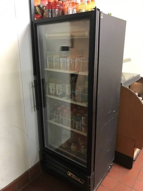 lot 18 image: True GDM-12-HC-LD 25 One Section Glass Door Merchandiser with Swing Door 115v Overall Dimensions 2478 in. W x 2318 in. D x 6238 in. HRuns Cools