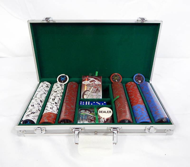 lot 121 image: 300 Chip Aluminum Poker Chip Case with Skull Chips, Orange County Choppers Playing Cards and Dice