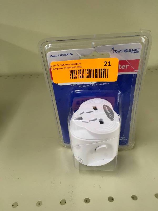 lot 21 image: Travel Smart All-In-One Adapter, Retail $11.99