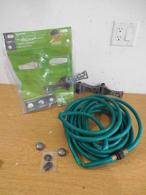 lot 104 image: Orbit Spray Sled Lawn Sprinkler 2,100-sq ft