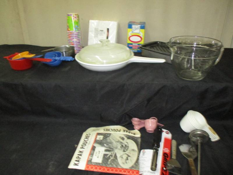 lot 17 image: Nice pan with lid, measuring cups, and misc