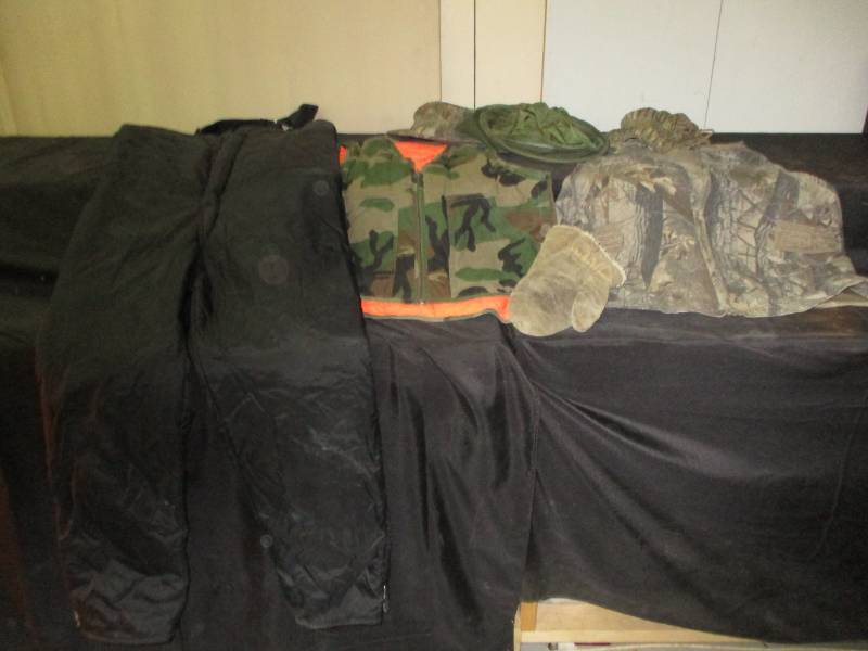 lot 36 image: Walls X-Large Snow Pants, Reversible orange and cammo vest, cammo vest and 3 caps one with bug screen and choppers