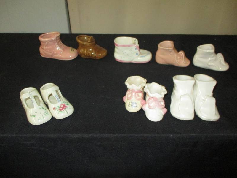 lot 102 image: Antique little porclein shoes