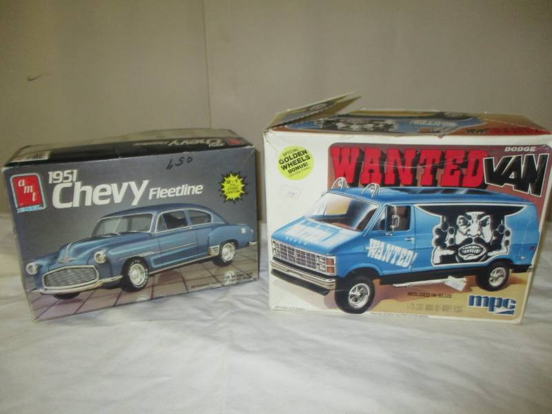 lot 195 image: 1951 Chevy Fleetline and Wanted Van still in plastic , Seems like all the pieces are there as is