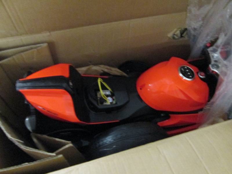 lot 126 image: Orange Motorbike with LED Lights op...