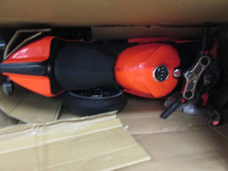 lot 215 image: Orange Motorbike with LED Lights op...
