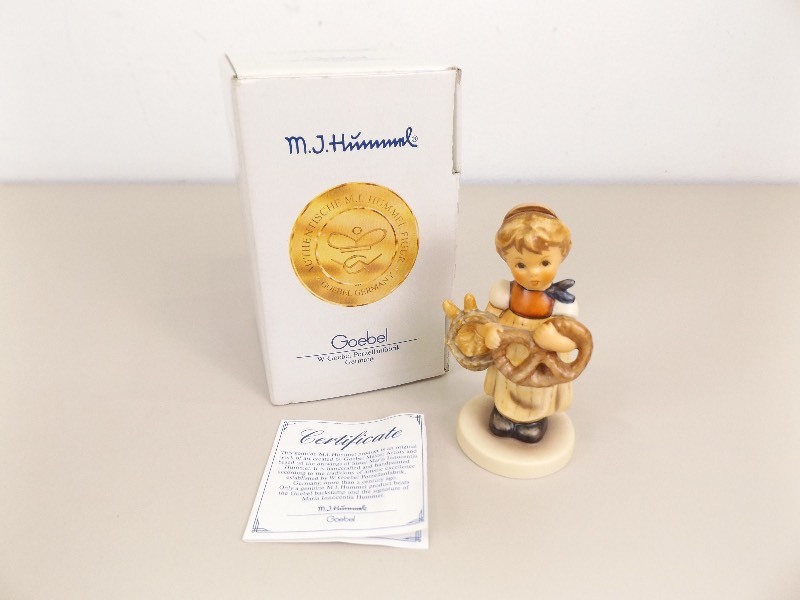 lot 53 image: Vintage M.J. Hummel Goebel Pretzel Girl #2004 In Original Box