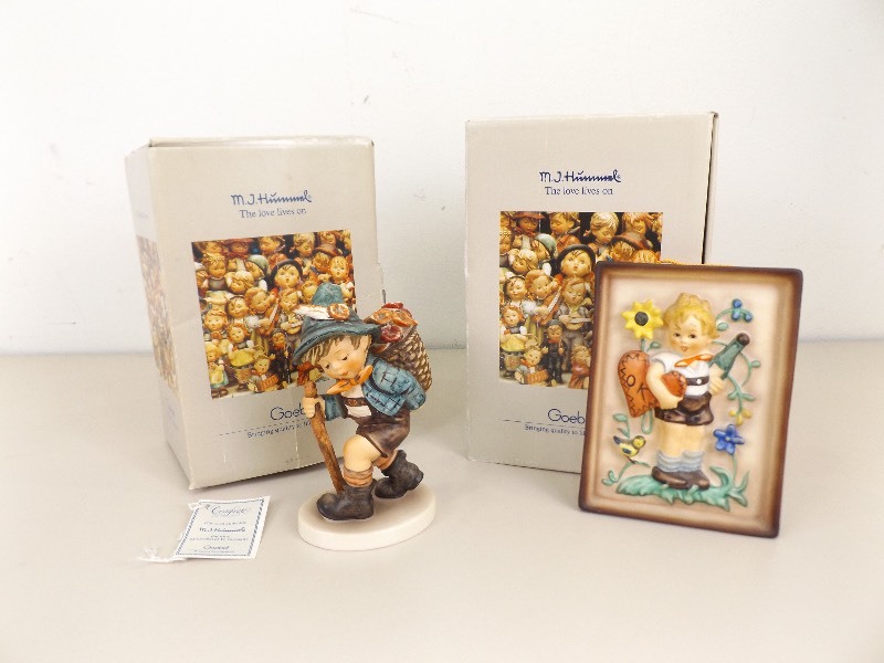 lot 63 image: 2&nbspVintage M.J. Hummel Goebel Flower Vendor #745, and Standing Boy Plaque #168 In Original Boxes
