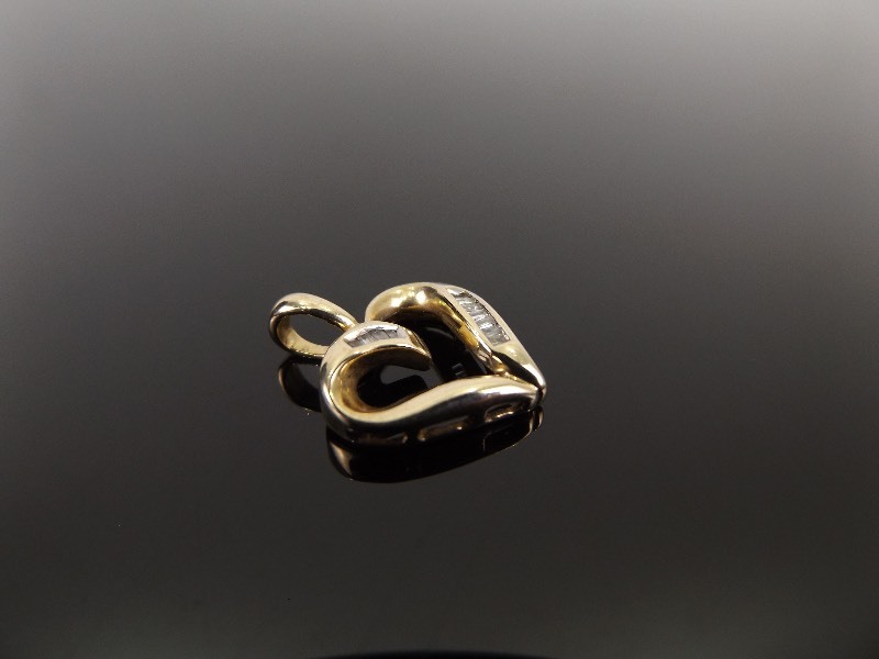 lot 30 image: 10k Yellow Gold Diamond Baguette Heart Pendant