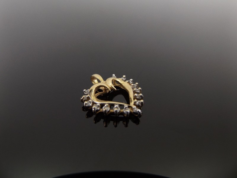 lot 31 image: 10k Yellow Gold Diamond Accented Heart Pendant