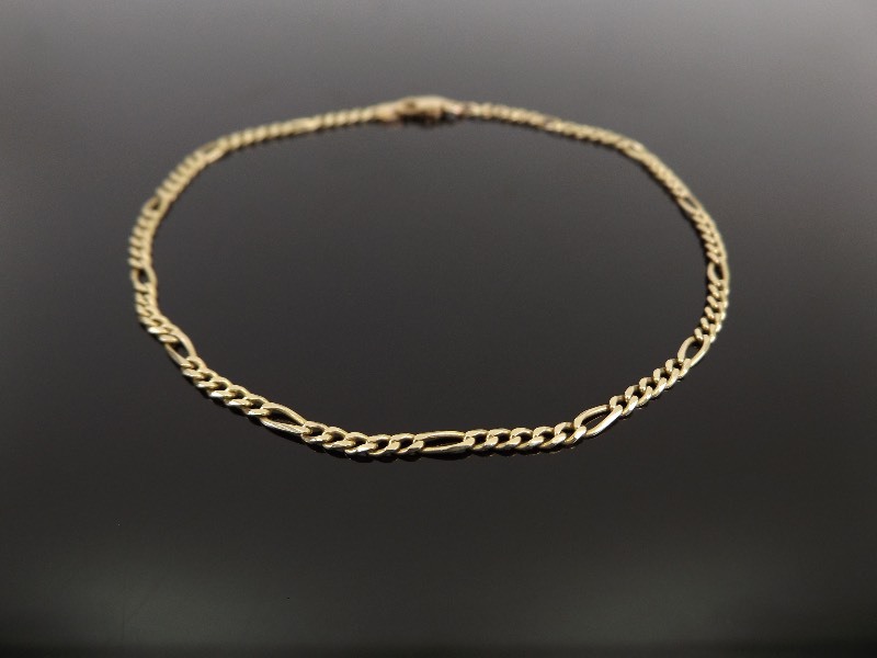 lot 34 image: 14k Yellow Gold Figaro Link Bracelet