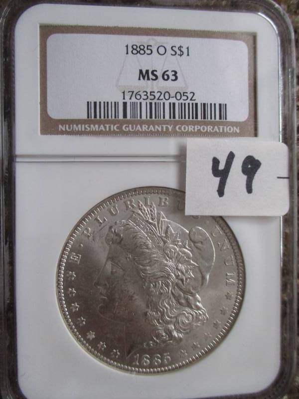 lot 49 image: 1885 O Moragn Silver Dollar MS63