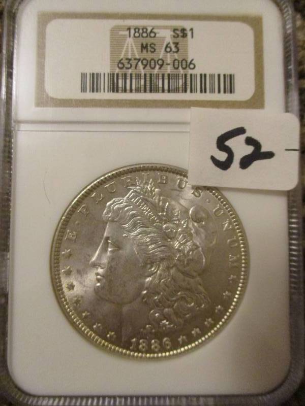 lot 52 image: 1886 Morgan Silver Dollar MS63